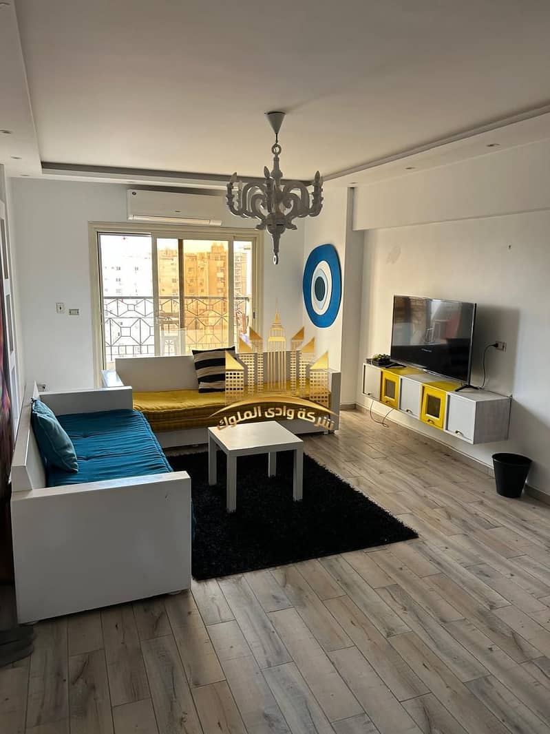 Apartment for rent in Baron City Compound, Maadi Ring Road, next to Sama Cairo Tower, area 125 m, high luxury finishing, 11th floor, 2 bedrooms, 2 bathrooms, big reception, American bar kitchen, and side living room. – pohled 6
