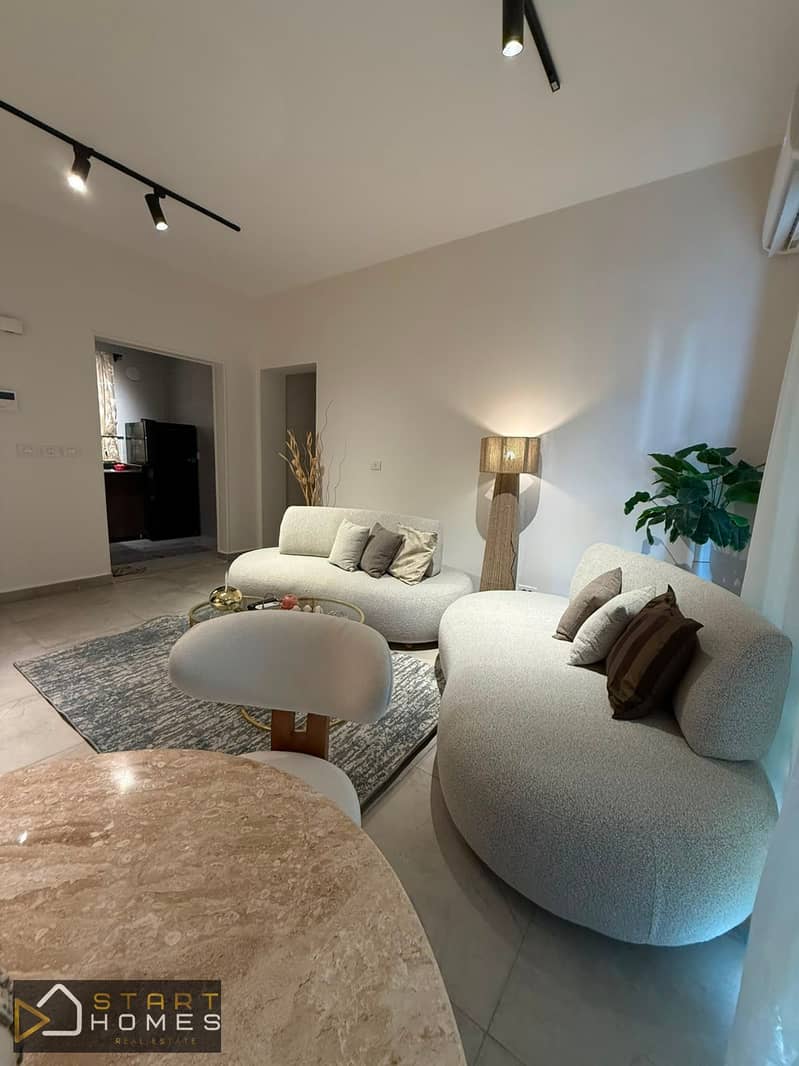 Fully furnished 100-square-meter, two-bedroom apartment for rent in Privado, Madinaty; features custom finishes and brand-new furniture and appliances - Aanzicht 2