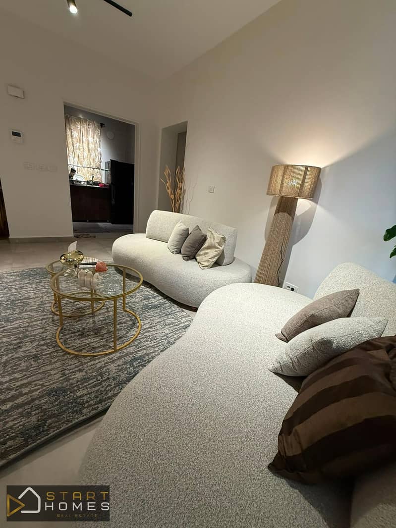 Fully furnished 100-square-meter, two-bedroom apartment for rent in Privado, Madinaty; features custom finishes and brand-new furniture and appliances - Meer