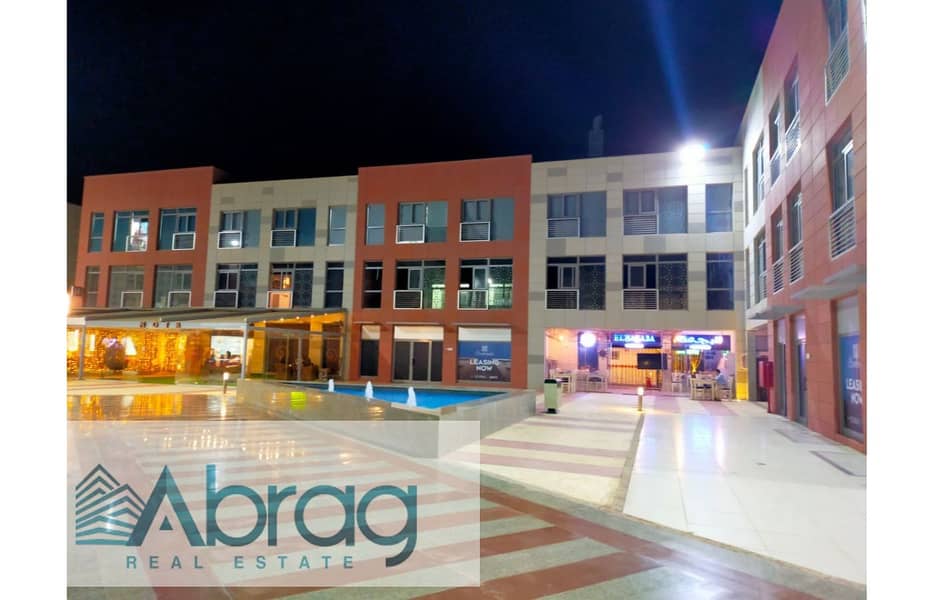 Ground floor commercial shop for sale in The Courtyard Mall, heart of Sheikh Zayed, with a high return on investment. - Fler