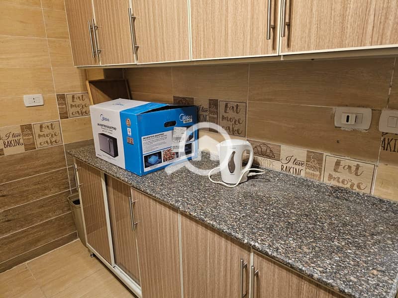 For rent, an apartment in the Jannah Misr compound in New Cairo, close to the American University and the Southern 90th Street. - Vue 5