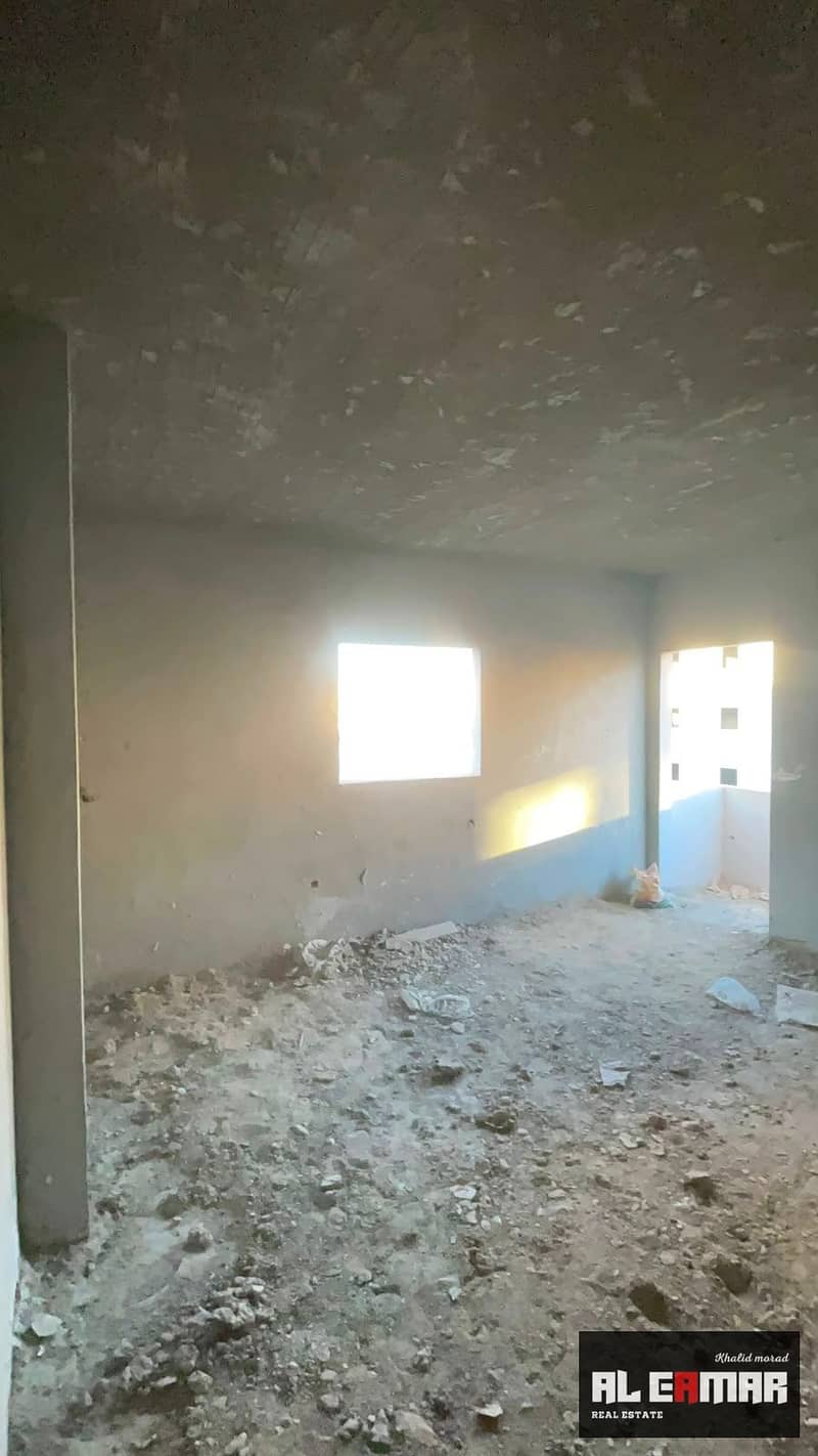 Semi-finished apartment for sale in the First Tourist District, next to Al-Nadi Club, 6th of October City. - Vista 4