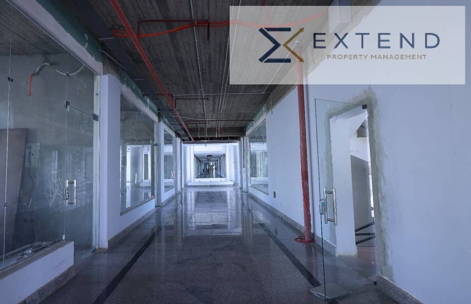 At a special price per meter in the most important locations of 6th of October on the central axis, a café for rent with interior and outdoor spaces inside a commercial mall with high vitality. - Fler