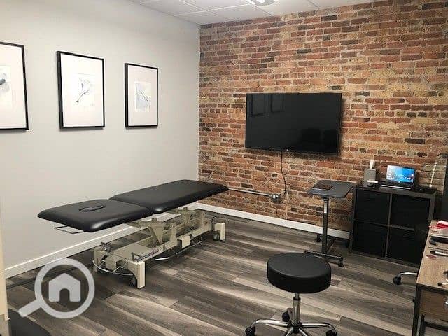 2 Chiropractic Adjustment Area with Exposed Brick. jpeg
