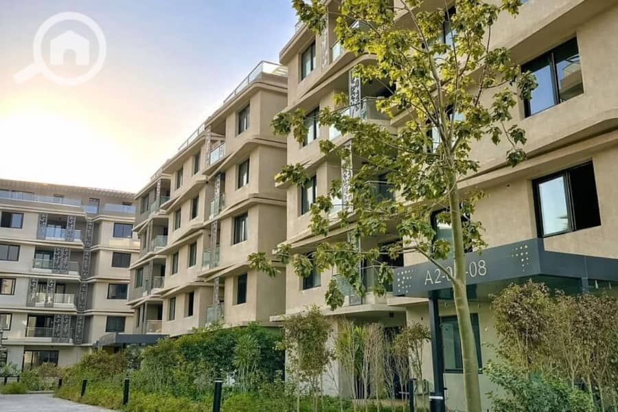 8 Modern apartment complex at sunset. png