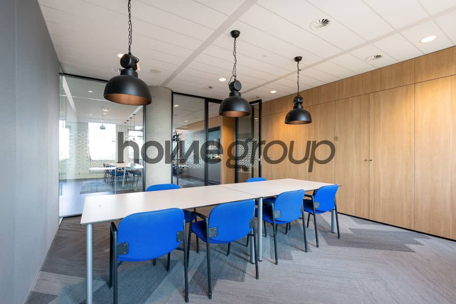 9 meeting-room-interior-modern-office-with-long-wooden-table-chairs-around-it. jpg