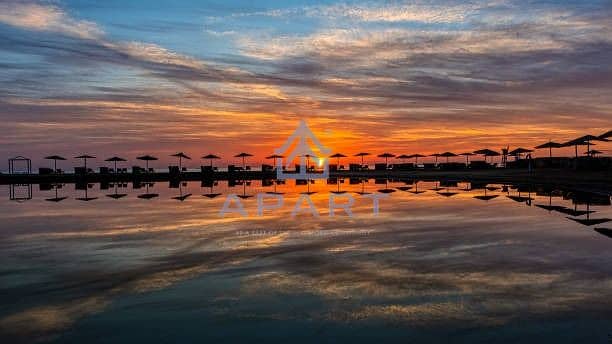 2 imgi_52_sunset-over-the-lagoon-with-umbrellas-an-loungers-reflecting-in-the-water. jpg