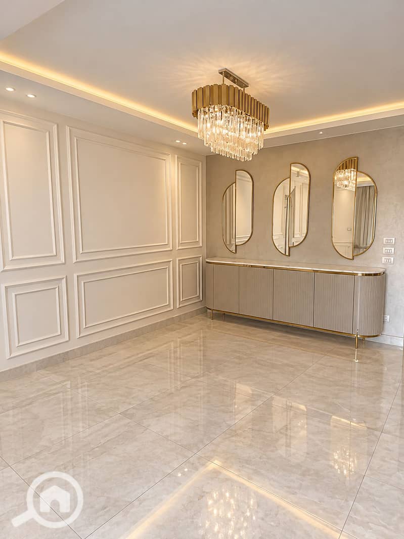 2 Empty Elegant Dining Room with Crystal Chandelier. png
