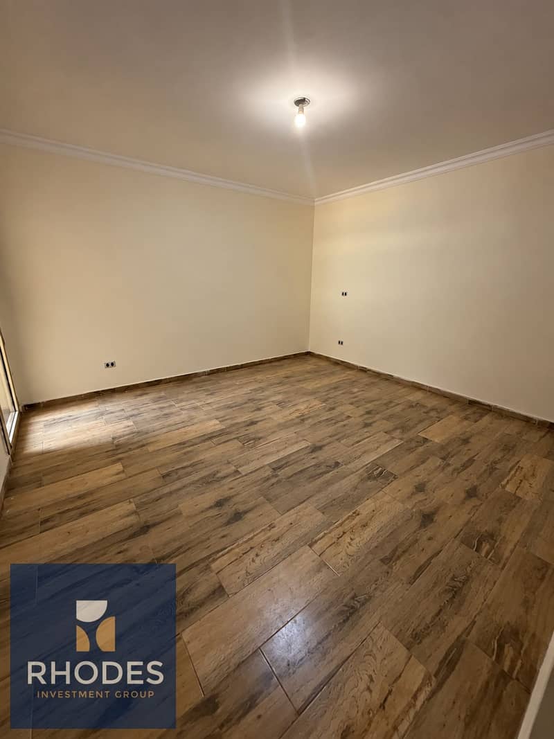 7 Empty Cream Room with Wood-Look Flooring. png