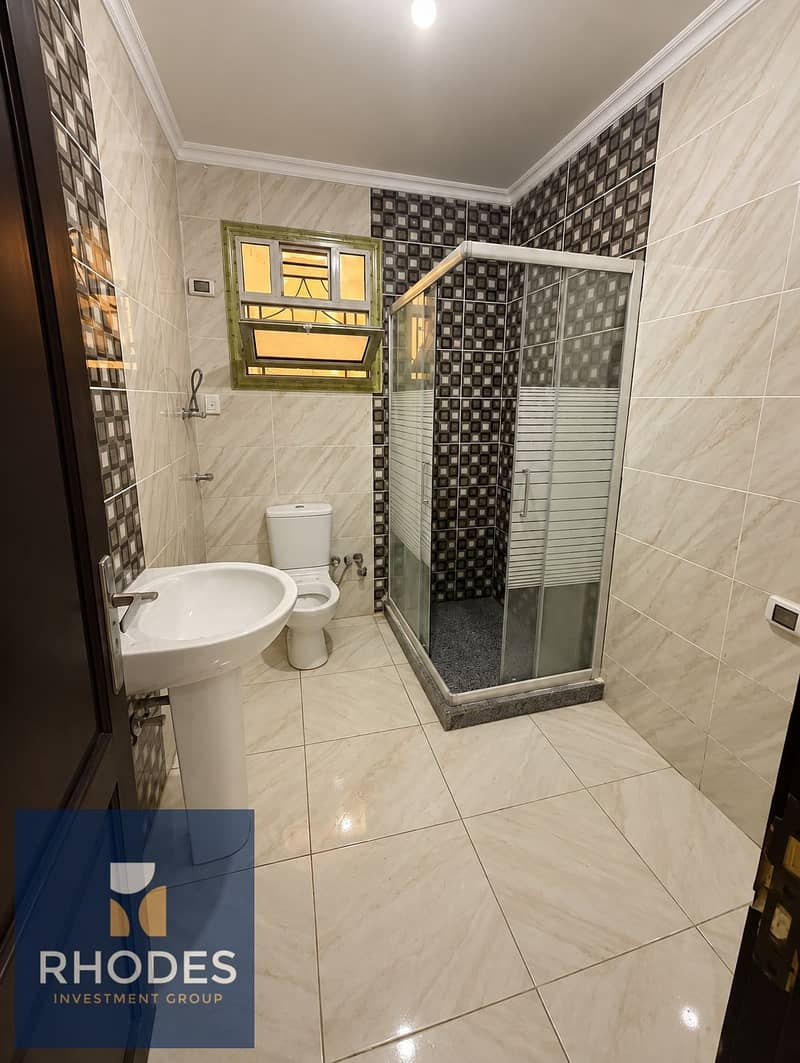 6 Modern Marble Bathroom with Glass Shower. png
