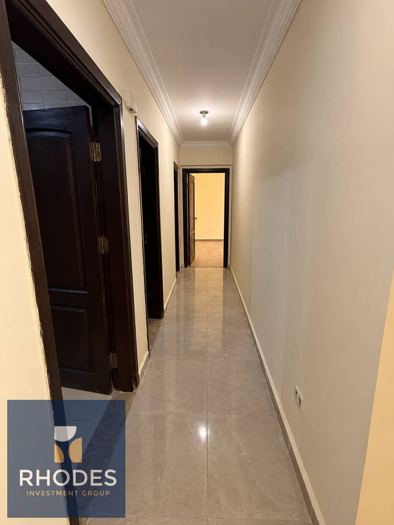 7 Warm Marble Hallway with Dark Wood Doors. png