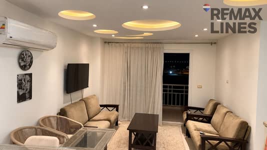 2 Bedroom Apartment for Rent in Madinaty, Cairo - غرفة معيشة أنيقة بإطلالة ليلية. png 2 Bedroom Apartment for Rent in Madinaty, Cairo - غرفة معيشة أنيقة بإطلالة ليلية. png