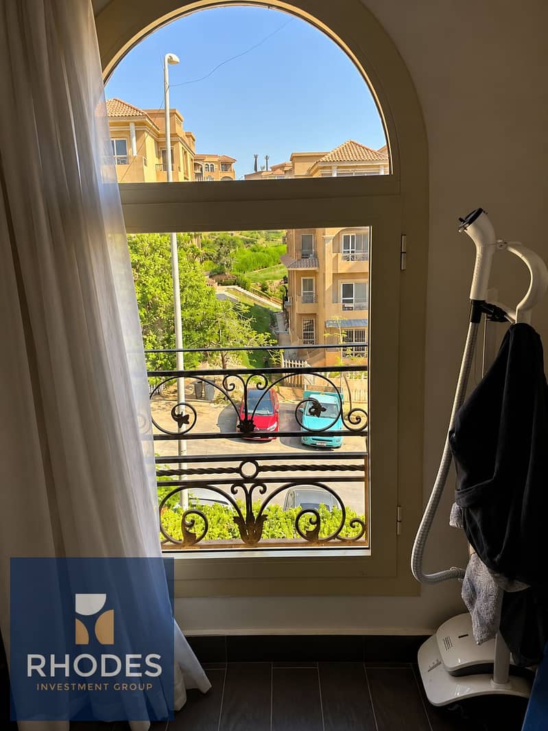 3 Mediterranean Neighborhood Through Arched Window. png