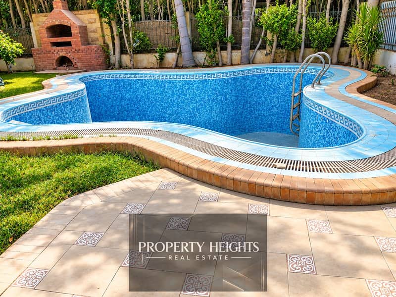 2 Sunlit Empty Mosaic Pool Courtyard. png