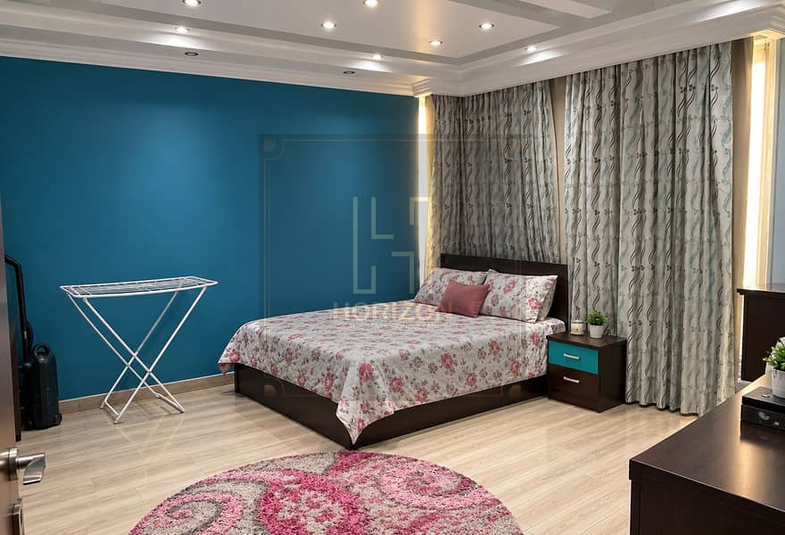 4 Tidy Teal Bedroom with Floral Bedspread. png