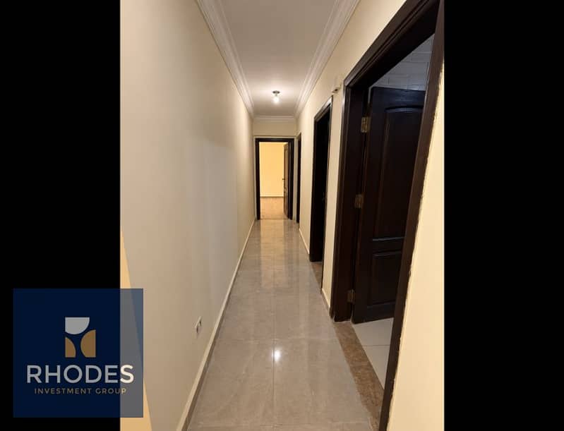 9 Warm Marble Hallway with Dark Wood Doors. png
