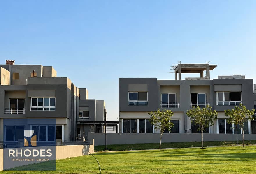 9 Modern Gray Townhouses Under Blue Skies. png