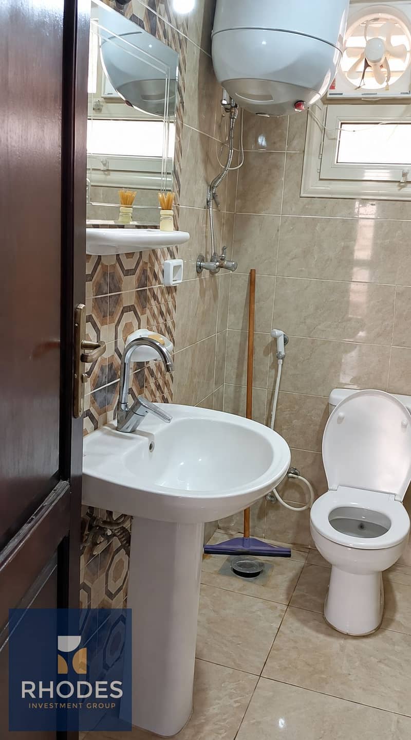 5 Compact Marble-Tiled Bathroom Interior. png