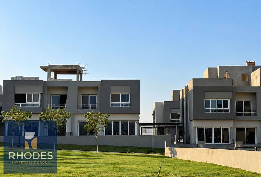 8 Modern Gray Townhouses Under Blue Skies. png