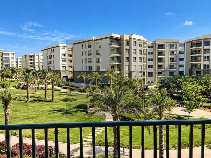 9 Sunlit Apartment Courtyard with Palm Gardens. png