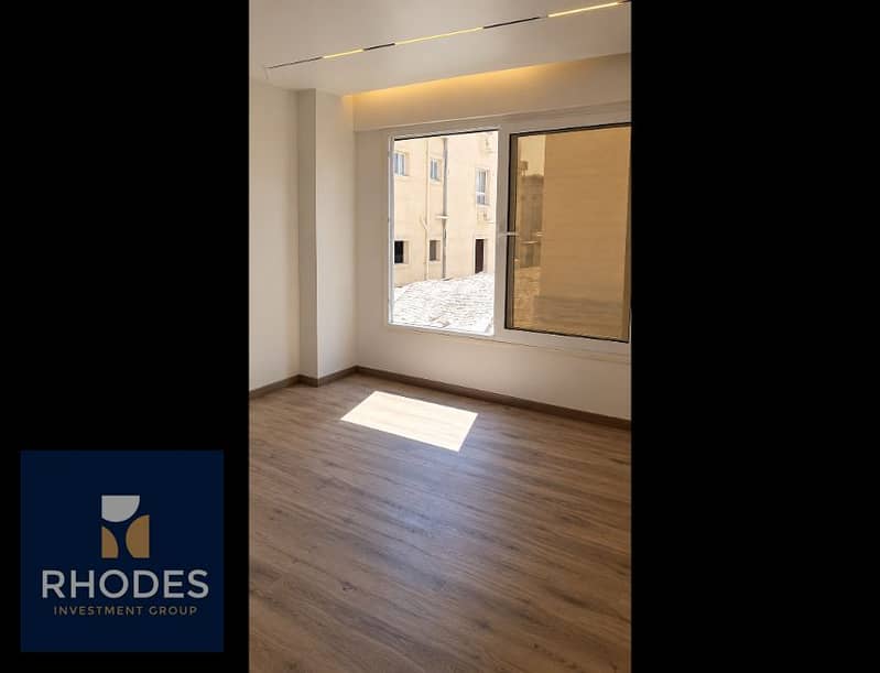 2 Bright Minimalist Room with Urban Window View. png