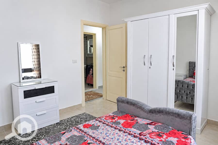 5 Bright Modern Bedroom with Red Floral Bedding. png