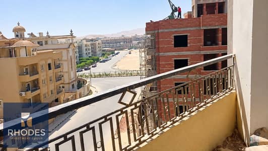 3 Bedroom Apartment for Sale in Sheikh Zayed, Giza - Sunny Balcony Overlooking Urban Construction. png