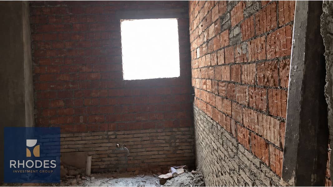 9 Unfinished Brick Room with Bright Window. png