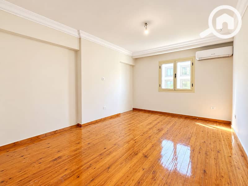 3 Bright Empty Room with Glossy Wooden Floors. png