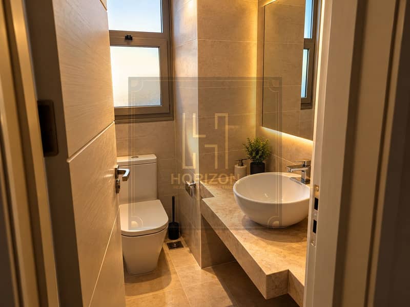 3 Warm Modern Bathroom Through Doorway. png