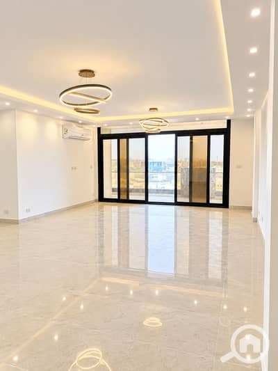 3 Bedroom Flat for Rent in New Cairo, Cairo - Bright Modern Room with Ring Chandeliers. png