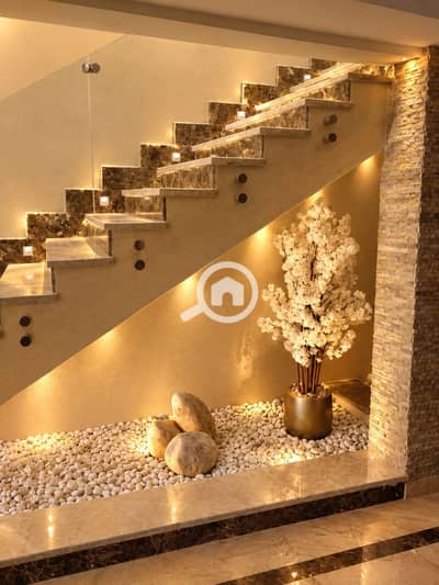 4 Bedroom iVilla for Rent in New Cairo, Cairo - Warm Under-Stair Zen Garden. png