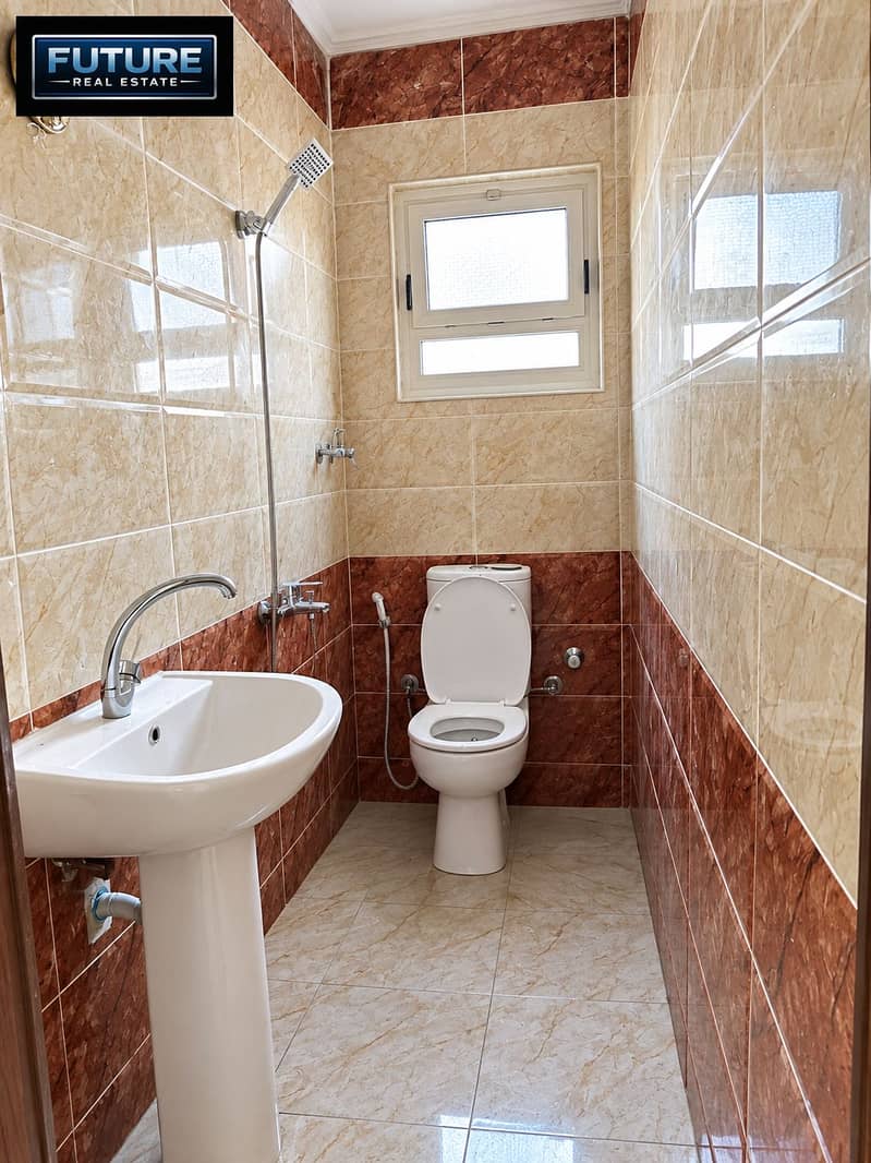 7 Glossy Beige Marble Bathroom with Open Toilet. png