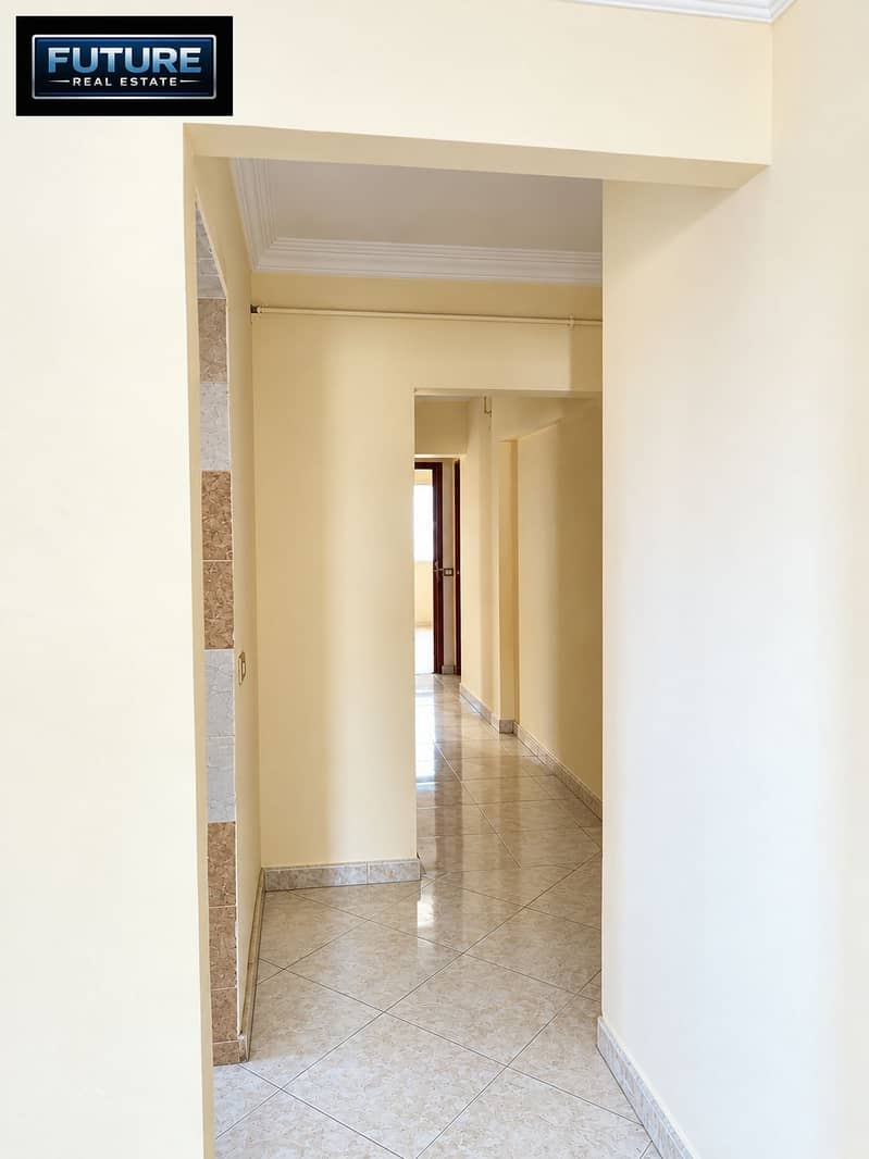 8 Sunlit Marble-Floored Apartment Hallway. png
