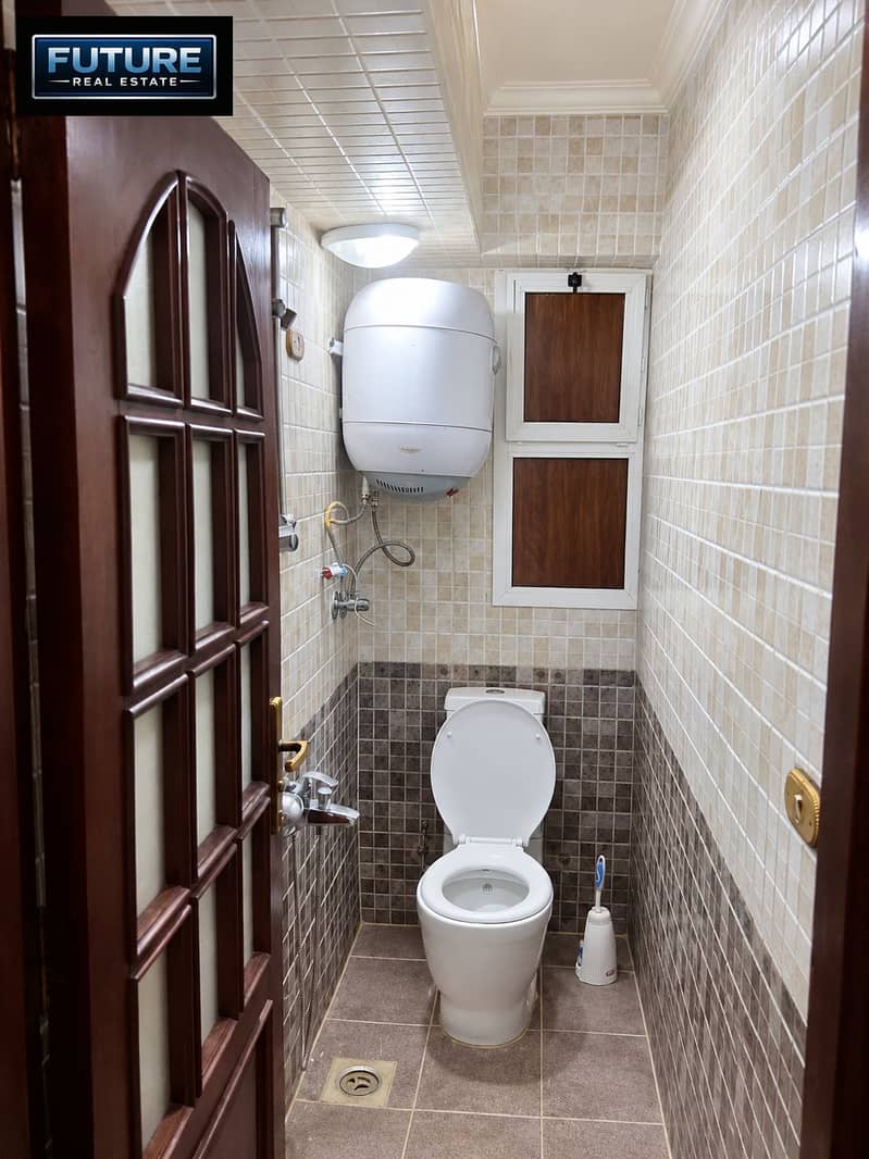 3 Compact Mosaic-Tiled Bathroom Interior. png