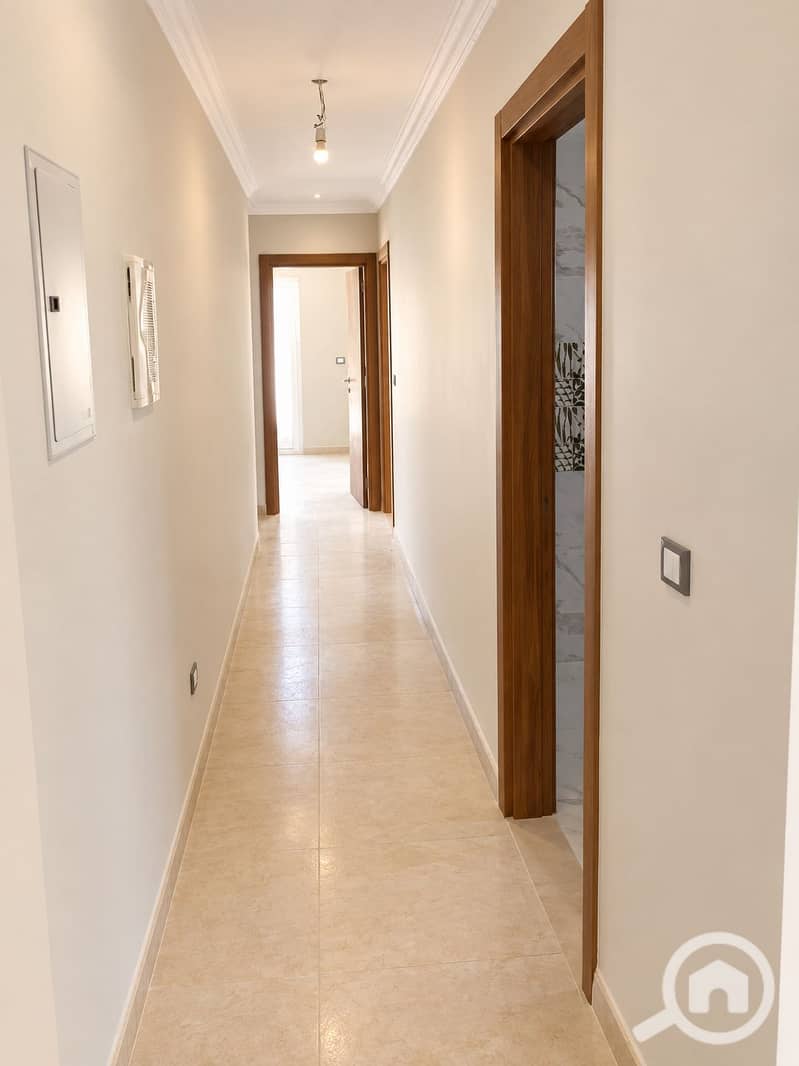 2 Bright Neutral Hallway with Open Door. png