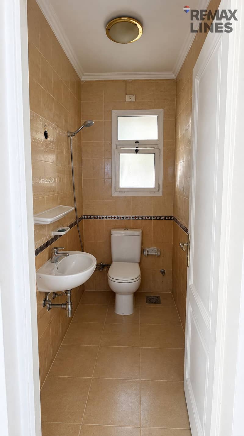 11 Centered Beige-Tiled Bathroom Interior. png
