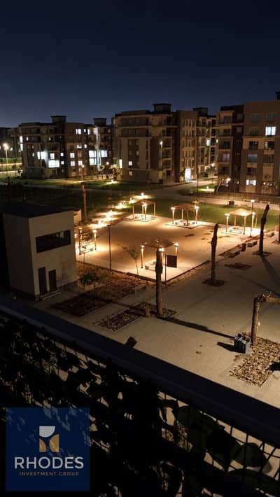 3 Bedroom Flat for Sale in Sheikh Zayed, Giza - Warmly Lit Apartment Courtyard at Night. png