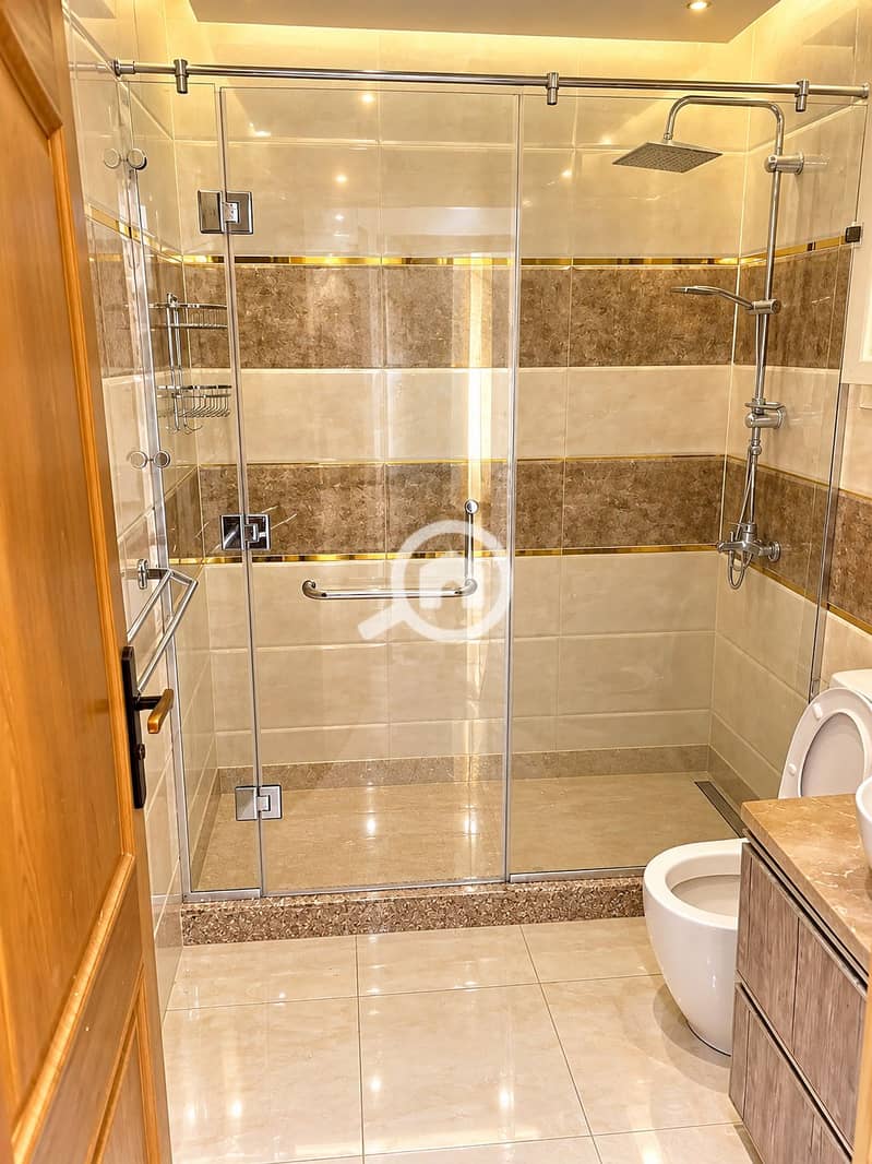 5 Luxe Marble Bathroom with Glass Shower. png