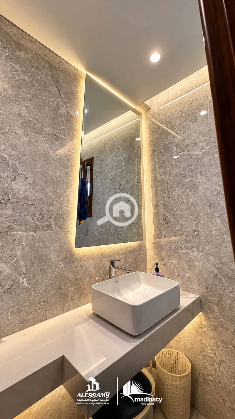 3 luxury_standalone_villa_for_sale_in_madinatyIlluminated Marble Vanity Corner. png