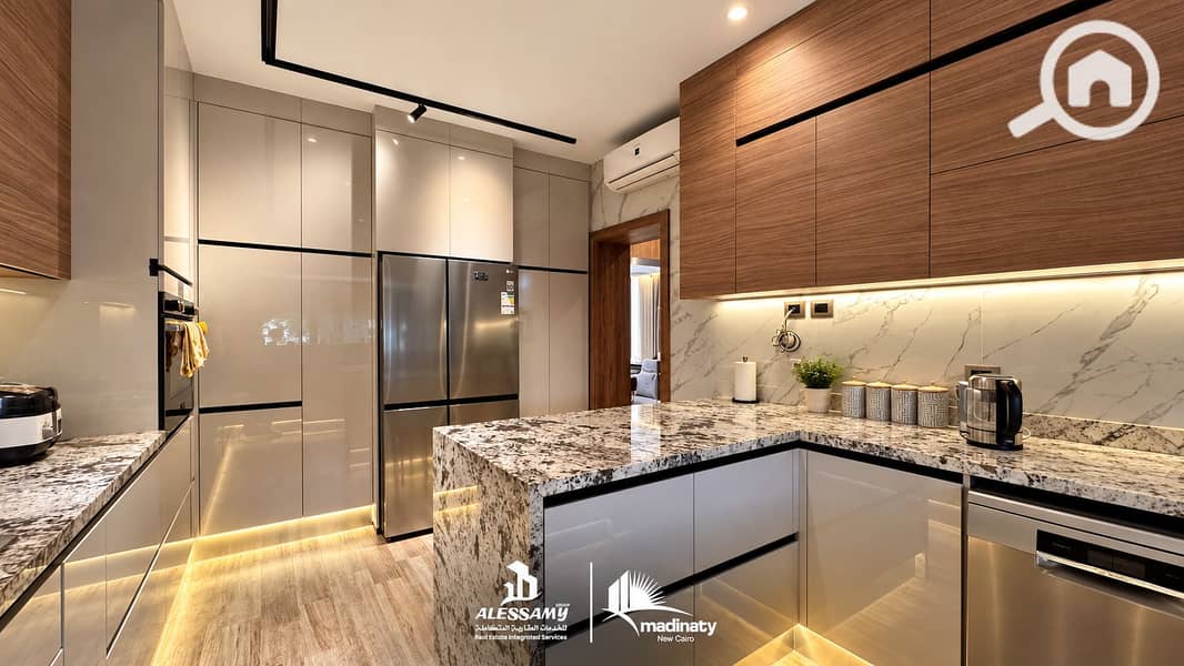 4 luxury_standalone_villa_for_sale_in_madinatyLuxury Modern Kitchen with Integrated Branding. png