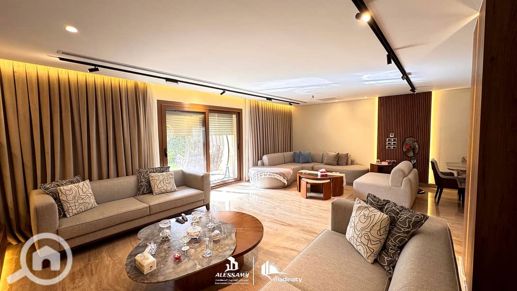 9 luxury_standalone_villa_for_sale_in_madinatyliving_room_4k_with_original_logo. jpg