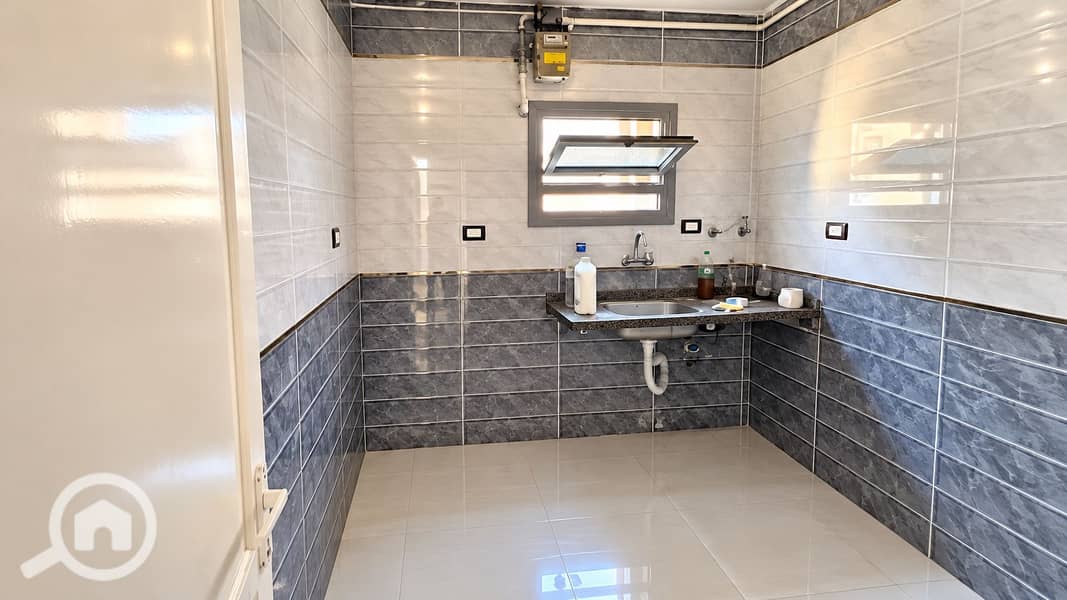 3 Bright Tiled Kitchen with Open Window. png