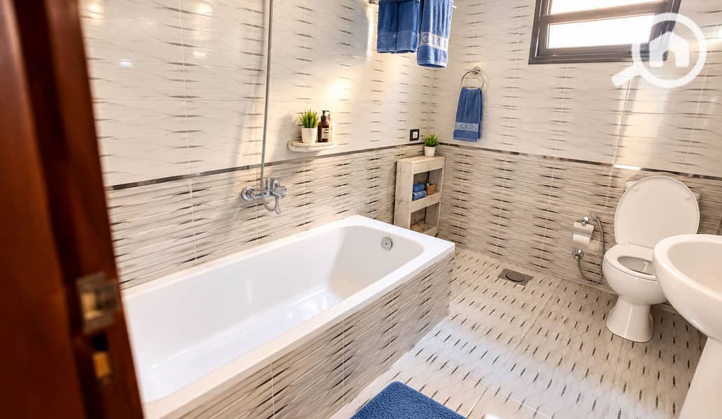 4 Bright Modern Bathroom with Blue Accents. png