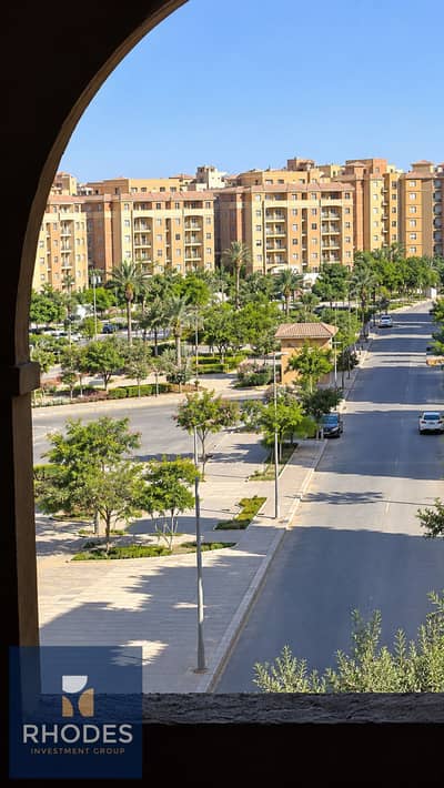 شقة 2 غرفة نوم للبيع في 6 اكتوبر، الجيزة - Sunlit Mediterranean Apartments Through Arch Window. png