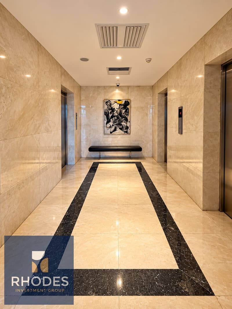 4 Luxurious Symmetrical Marble Elevator Lobby. png