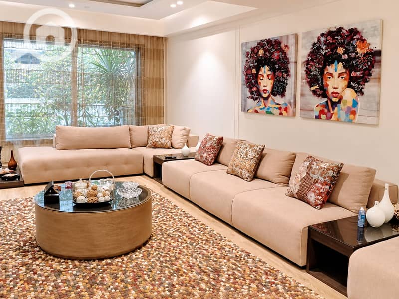 3 Elegant Neutral Living Room with Artistic Portraits. png