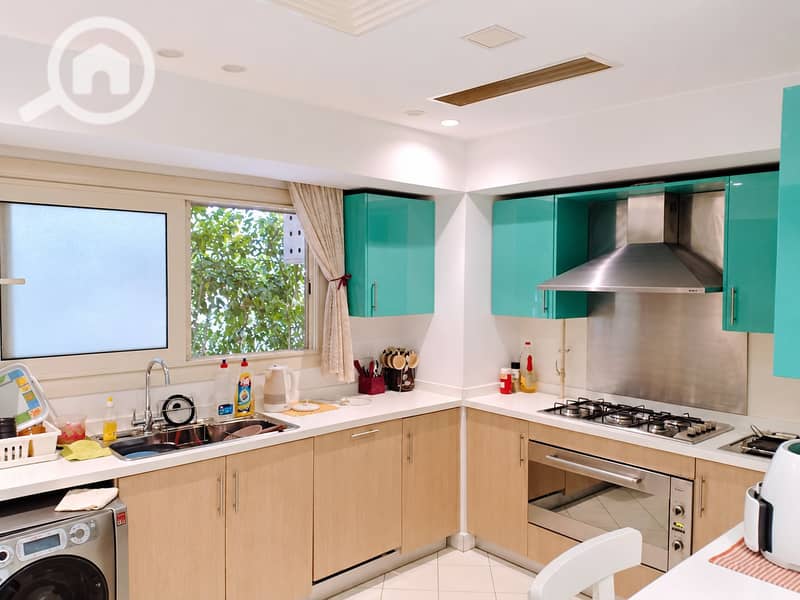 6 Bright Teal-and-Beige Modern Kitchen. png