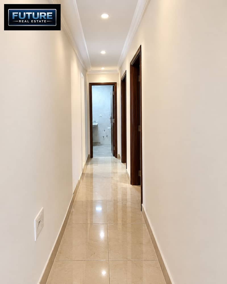 11 Modern Hallway Leading to Tiled Bathroom. png