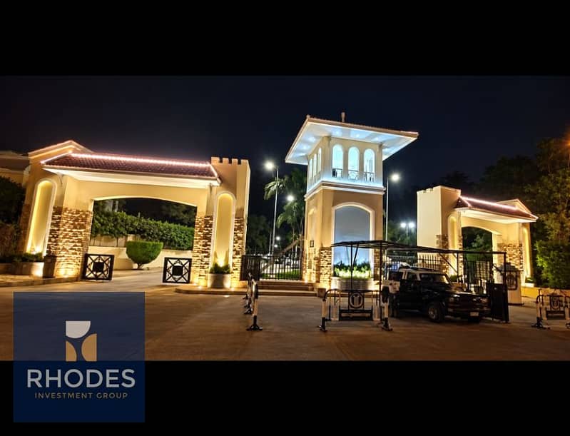 3 Illuminated Grand Gated Entrance at Night. png